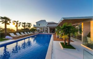 a house with a swimming pool in front of a house at Villa Petra Pag in Borovići