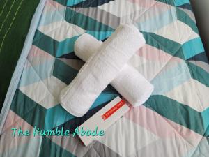 a pair of white socks laying on a quilt at The Humble Abode in Tagaytay +8 photos
