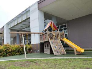 a playground in front of a building with a slide at The Humble Abode in Tagaytay