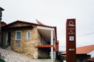 a building with a sign in front of it at Vougaldeias Casas da Seara in Sever do Vouga