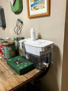 a kitchen sink sitting on top of a counter at Silver Valley Getaway in Kellogg +13 photos