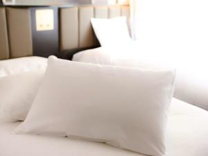 Gulta vai gultas numurā naktsmītnē APA Hotel Shonan Tsujido Ekimae