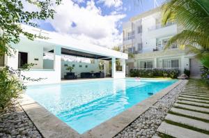 a swimming pool in the backyard of a house at Elegant 2 Bedroom Apartment with Pool in La Laguna