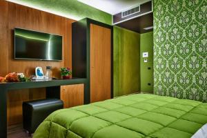 เตียงในห้องที่ Hotel Angioino & Spa