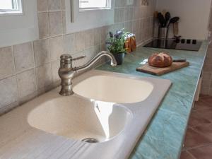 a bathroom sink with a faucet on a counter at Verdon in Aiguines