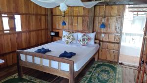 Paradiso Ocean front Bungalows客房内的一张或多张床位