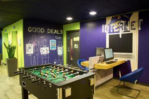 a office with a large foosball table in a room at ibis budget Birmingham Centre in Birmingham
