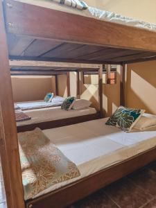 a group of bunk beds in a room at The Mayan Garden in Orange Walk +28 photos