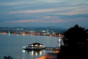 a view of a river at night with boats on it at Eser Premium Hotel & Spa in Büyükçekmece
