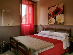 Kama o mga kama sa kuwarto sa Hotel Properzio