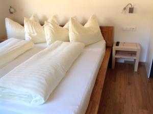 Ein Bett oder Betten in einem Zimmer der Unterkunft Großglockner Goldried Chalet