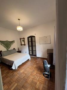 Ένα ή περισσότερα κρεβάτια σε δωμάτιο στο Recanto Ávila