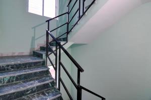 a set of stairs in a house at Hotel O Relax Inn in Kolkata