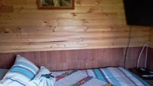 Postelja oz. postelje v sobi nastanitve Domos Arcoiris de Chiloé