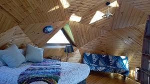 Postelja oz. postelje v sobi nastanitve Domos Arcoiris de Chiloé