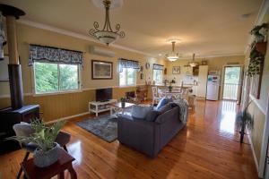 a living room with a couch and a table at Milford Country Cottages in Milford