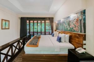 Dewangga Ubud客房内的一张或多张床位