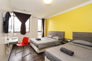 Postel nebo postele na pokoji v ubytování Parkland Hotel