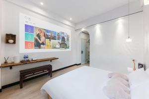 Ένα ή περισσότερα κρεβάτια σε δωμάτιο στο Quanzhou West Street Kaiyuan Temple Bandiao Inn