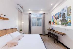 Ένα ή περισσότερα κρεβάτια σε δωμάτιο στο Quanzhou West Street Kaiyuan Temple Bandiao Inn