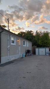 a house with a driveway next to a building at Whole House Fair Price Great Amenities in Richmond Hill +31 photos