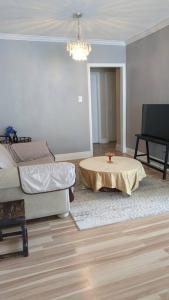 a living room with a table and a couch at Whole House Fair Price Great Amenities in Richmond Hill