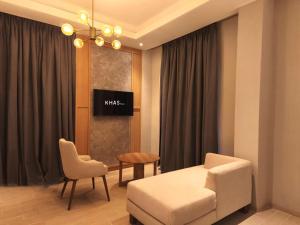 TV a/nebo společenská místnost v ubytování Khas Palu Hotel + 7 fotografií