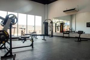 a gym with several tread machines in a room at Nuevo Loft con vista al mar a pocos pasos de la playa in Santa Marta