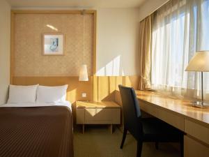 Postel nebo postele na pokoji v ubytování The OneFive Tokyo Kameido