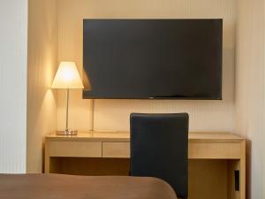 TV a/nebo společenská místnost v ubytování The OneFive Tokyo Kameido