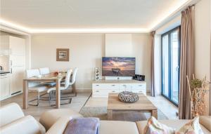 a living room with a table and a dining room at Princess in Binz +36 photos