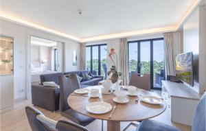 a living room with a table and chairs at Prince in Binz