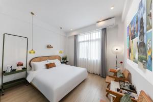 Ένα ή περισσότερα κρεβάτια σε δωμάτιο στο Quanzhou West Street Kaiyuan Temple Bandiao Inn