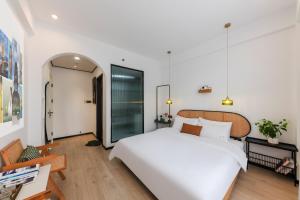 Ένα ή περισσότερα κρεβάτια σε δωμάτιο στο Quanzhou West Street Kaiyuan Temple Bandiao Inn