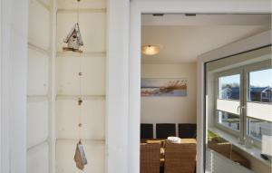 a hallway with a door leading to a room at Lovely Apartment In Dagebüll With Sauna in Dagebüll +31 photos