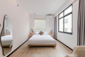 Ένα ή περισσότερα κρεβάτια σε δωμάτιο στο Quanzhou West Street Kaiyuan Temple Bandiao Inn