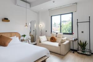 Ένα ή περισσότερα κρεβάτια σε δωμάτιο στο Quanzhou West Street Kaiyuan Temple Bandiao Inn