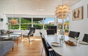 a dining room with a table and chairs at Lovely Home In Karrebæksminde With Wifi in Karrebæksminde