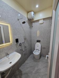 Koupelna v ubytování Step Home + 10 fotografií