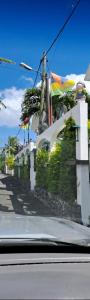 a building with flags on the side of a street at Cheerful 1 bed vacation home with tours & facilities in La Gaulette