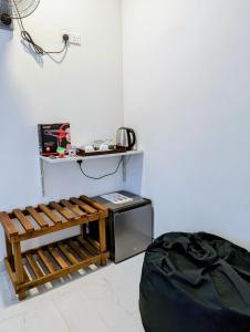 Příslušenství pro přípravu čaje a kávy v ubytování Rich Grove Inn