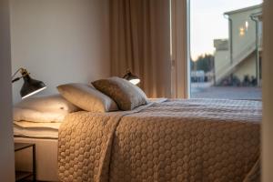 En eller flere senge i et værelse på Holiday Villa Marina D 10