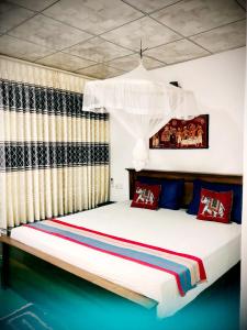 Postel nebo postele na pokoji v ubytování Priya Homestay Kandalama + 37 fotografií