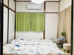 Fotografie z fotogalerie ubytování 近难波心斋桥 交通便利机场直达 日式传统一户建Yuan House NH-101 v Osace