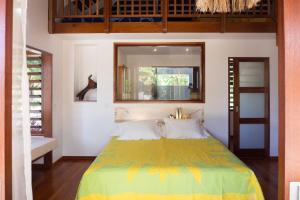 Postel nebo postele na pokoji v ubytování Moorea Reef Bungalows