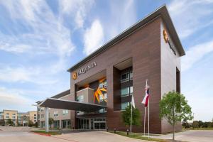 a rendering of the front of a building at La Quinta Inn & Suites by Wyndham Austin Parmer Tech Ridge in Austin