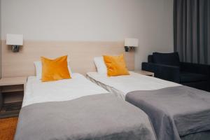 Postel nebo postele na pokoji v ubytování Hotel Sphinx