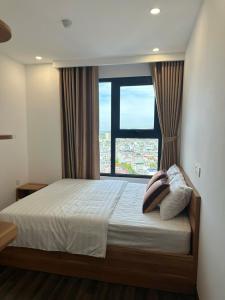 Giường trong phòng chung tại Nancy Homestay - Hoang Huy Commerce Apartment