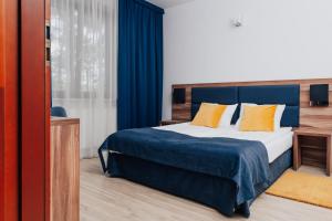 Postel nebo postele na pokoji v ubytování Hotel Sphinx + 37 fotografií