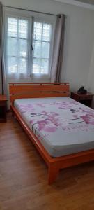 Postel nebo postele na pokoji v ubytování Chez Gilou